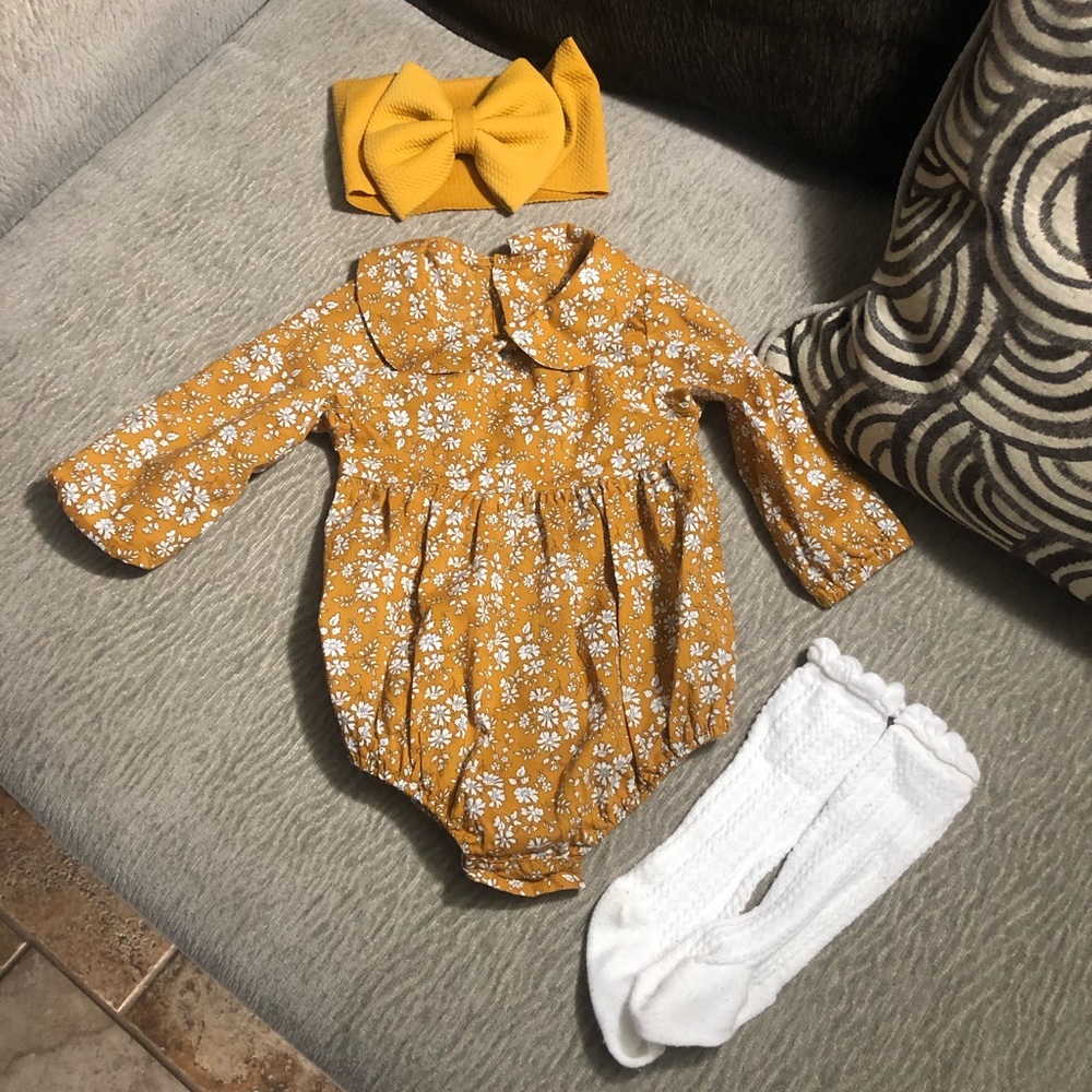 Infant romper with knee high socks and head wrap.